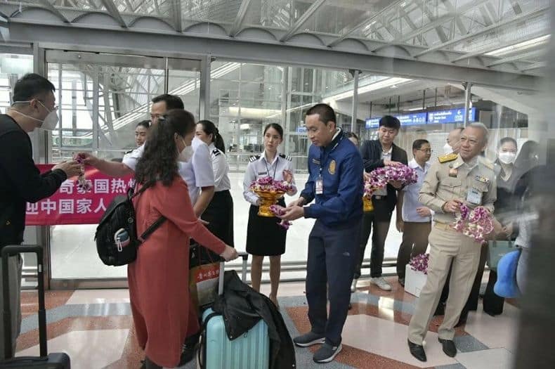 airport officials welcome tourists