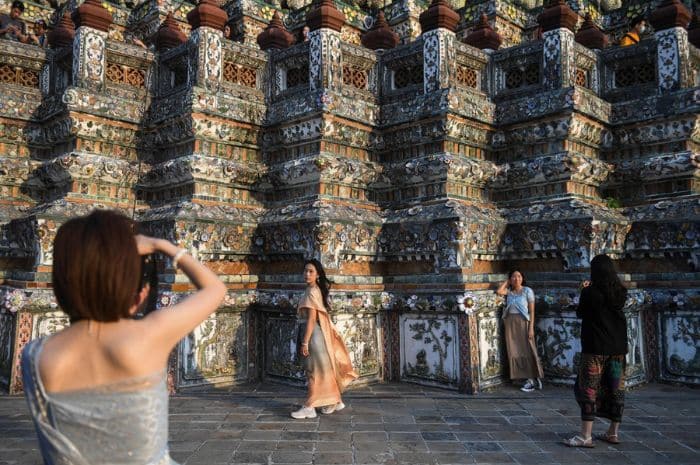 Chinese Tourists wearing thai clothes in Wat Arun temple